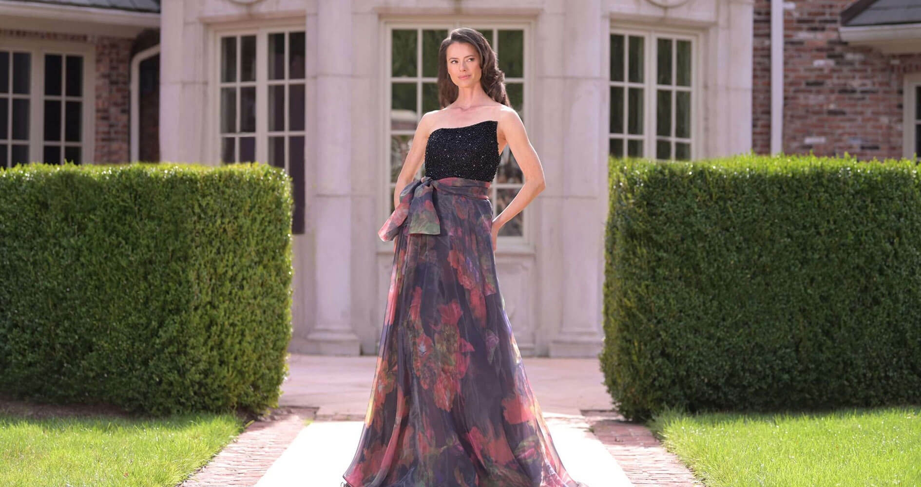 Model wearing a Rina Di Montella collection gown