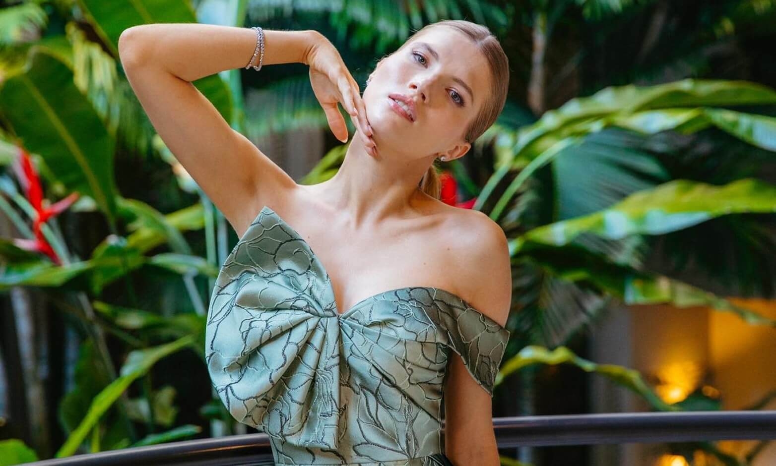 Model wearing a green dress
